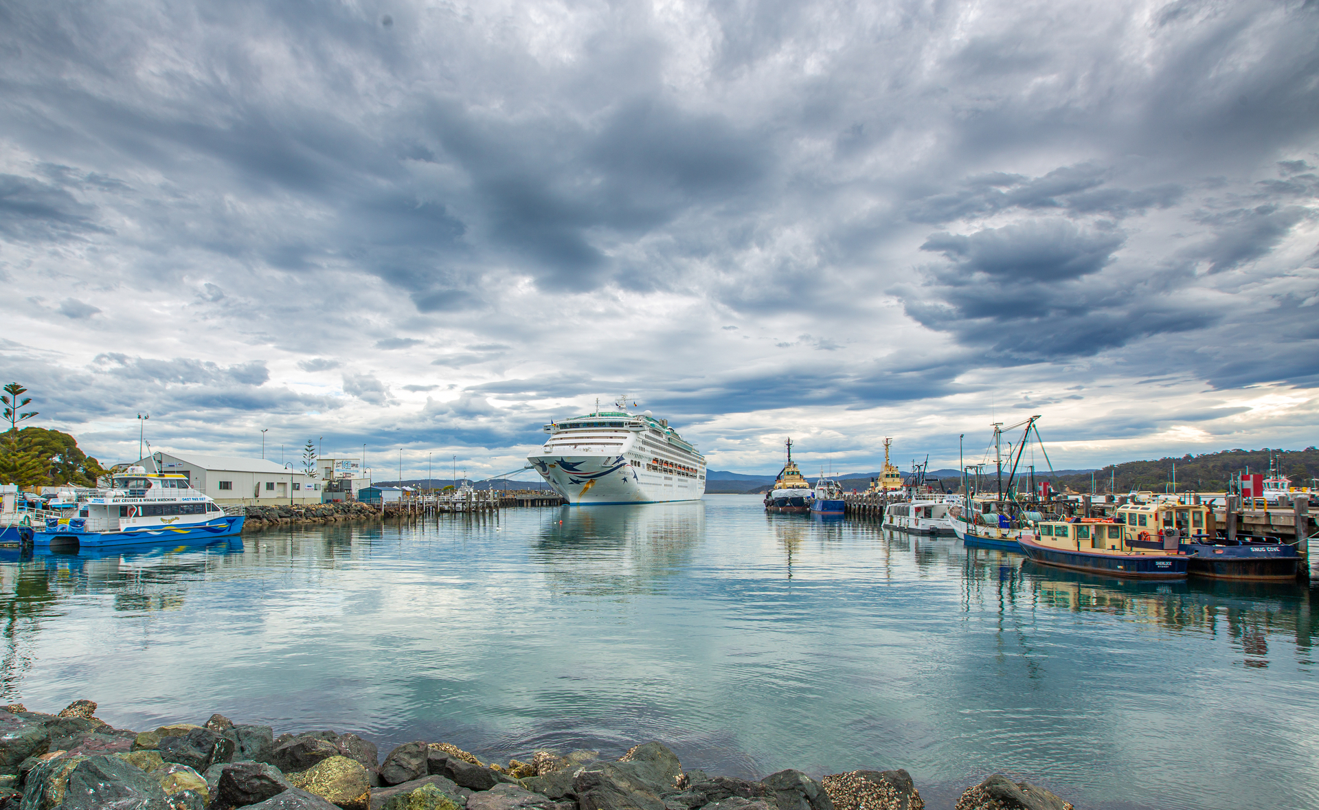 Vessels on the water moored at Eden including a cruise ship