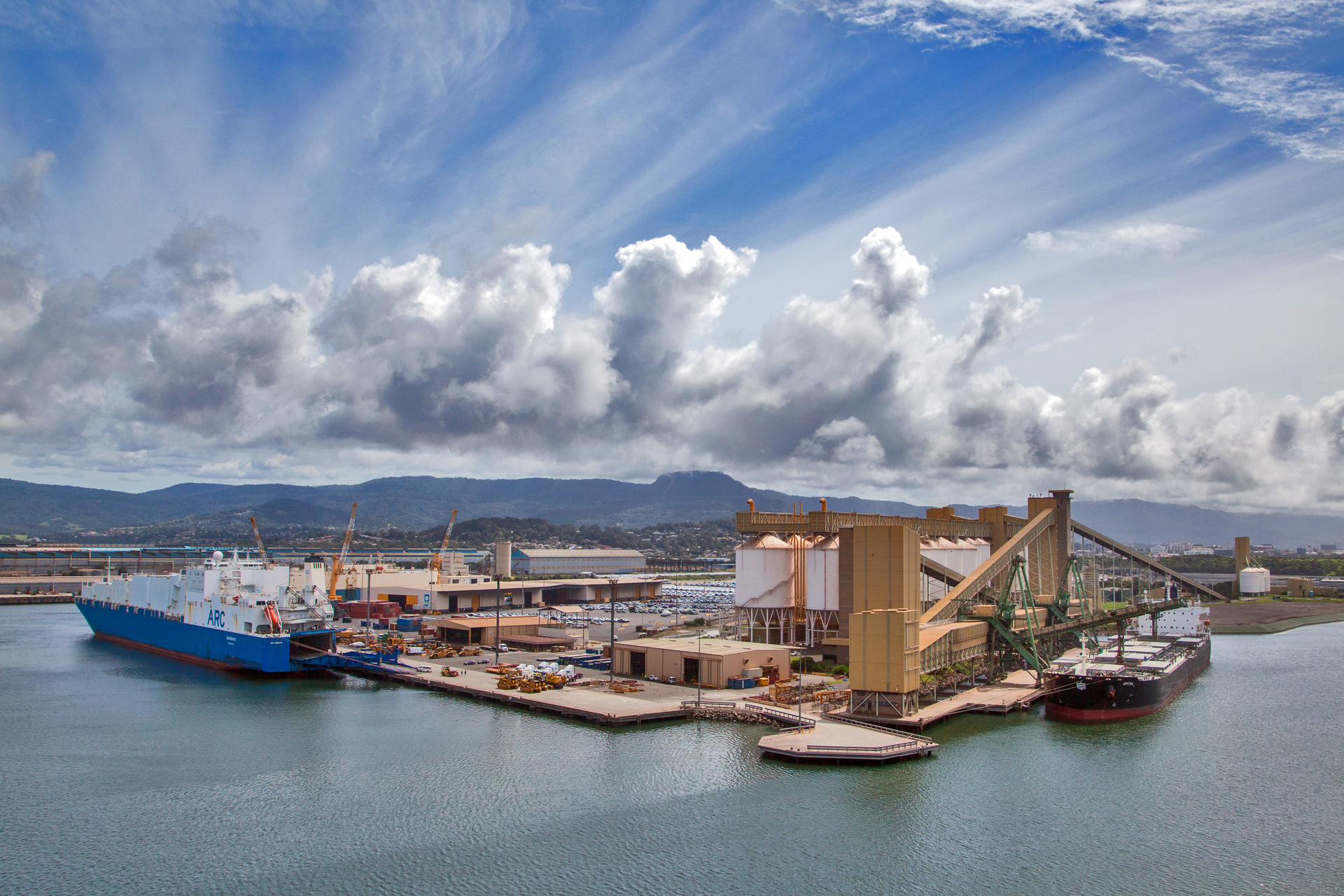 Aerial of Port Kembla port showing siloes and two ships docked