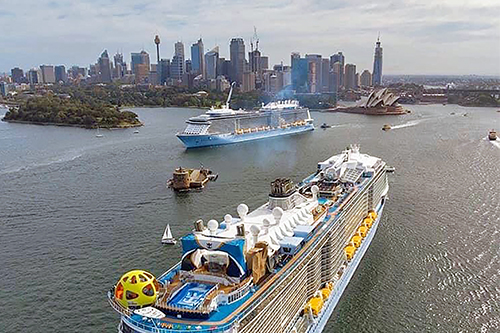 Two of the world’s biggest cruise ships meet in Sydney Harbour