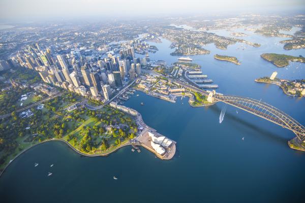 Aerial view of Sydney Harbour and CBD with Harbour Bridge and Opera House in foreground