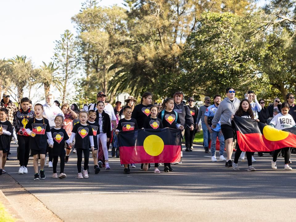 NAIDOC Week Newcastle march with flags