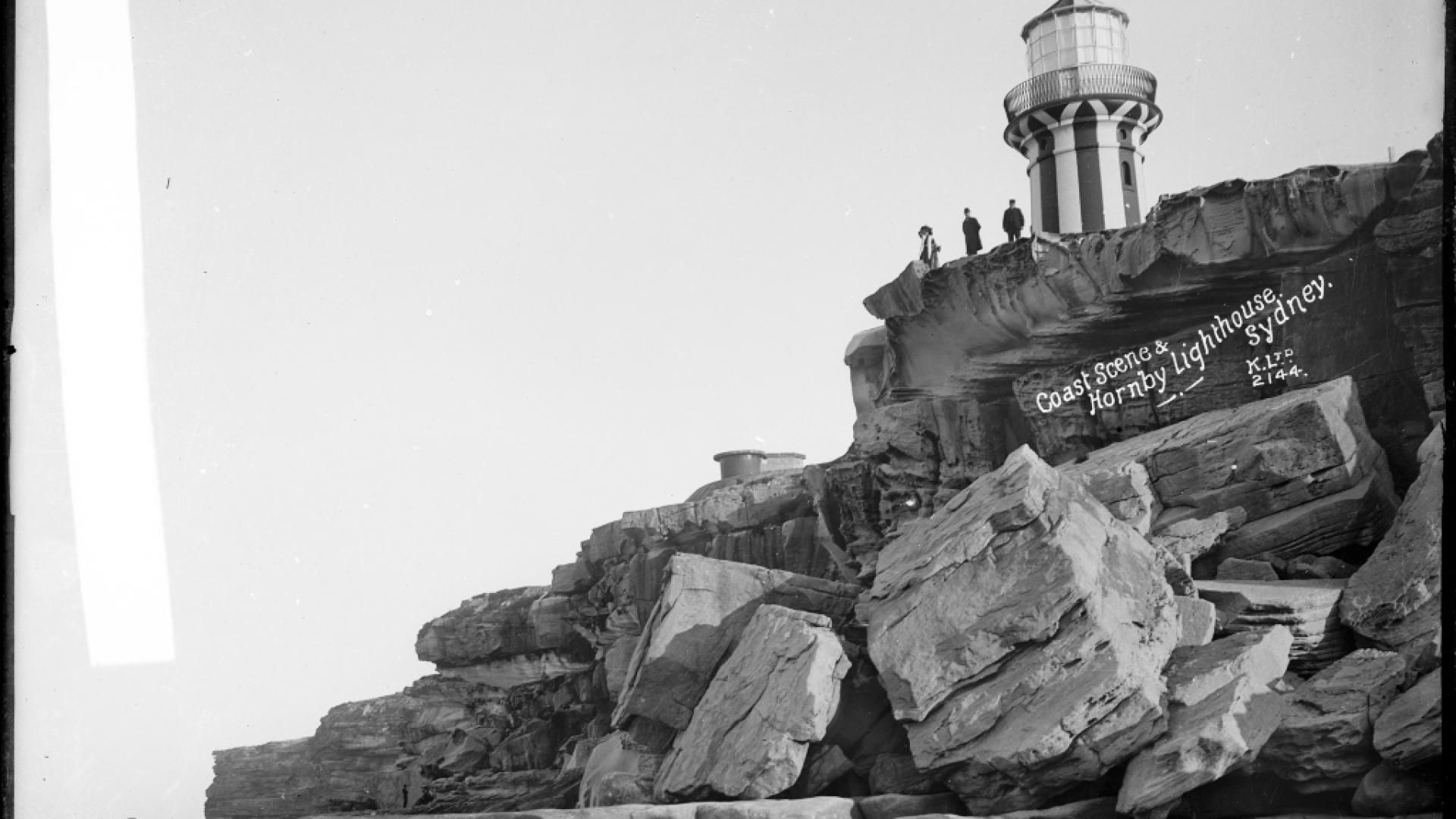 Old black and white photo of Hornby Lighthouse atop a cliff