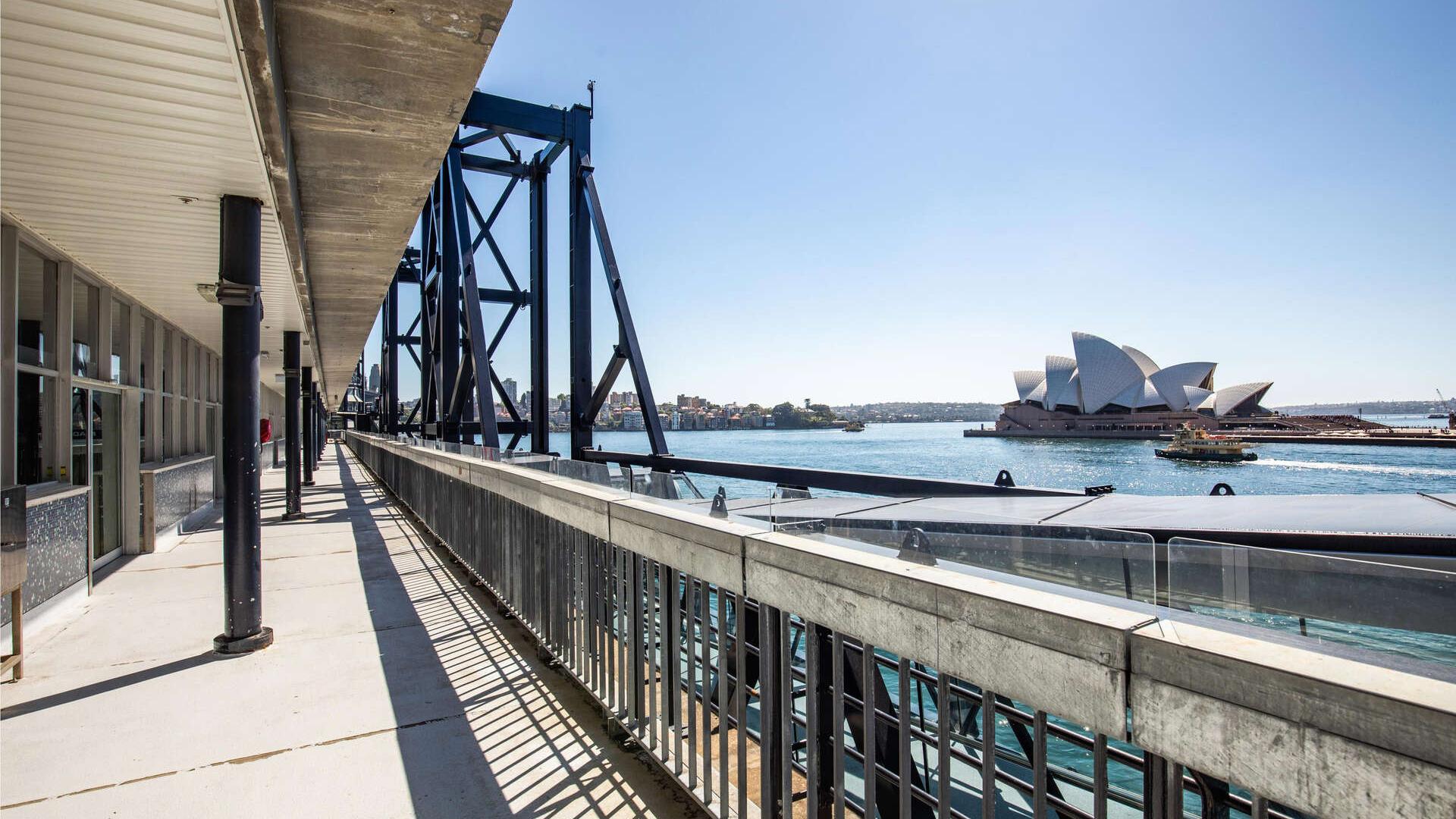 Standing on the balcony of the OPT looking along the balcony with the Opera House on the right