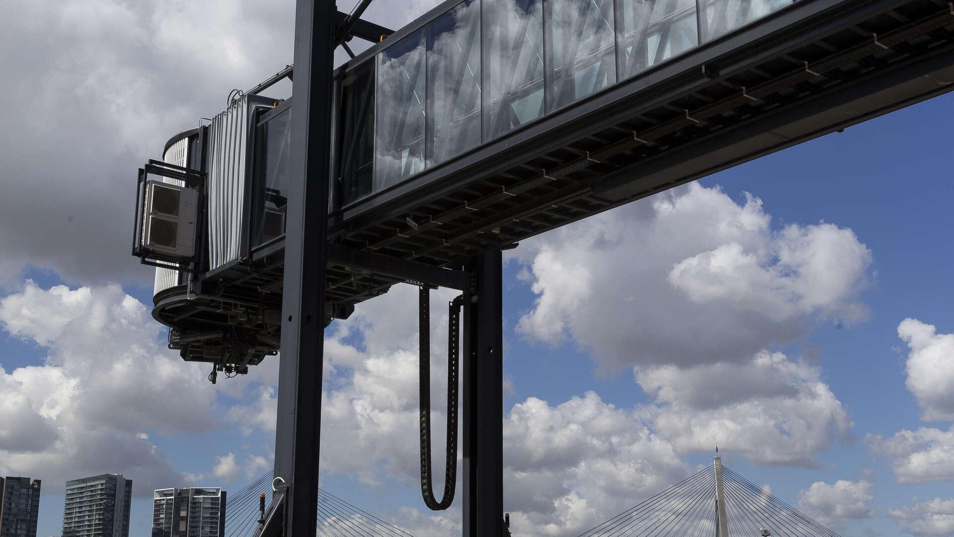 Looking up at the protruding gangway with Anzac Bridge in backgroun