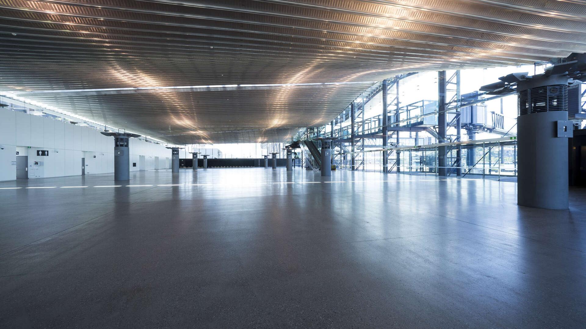 Inside an empty White Bay Cruise Terminal showing floor, ceiling and walls