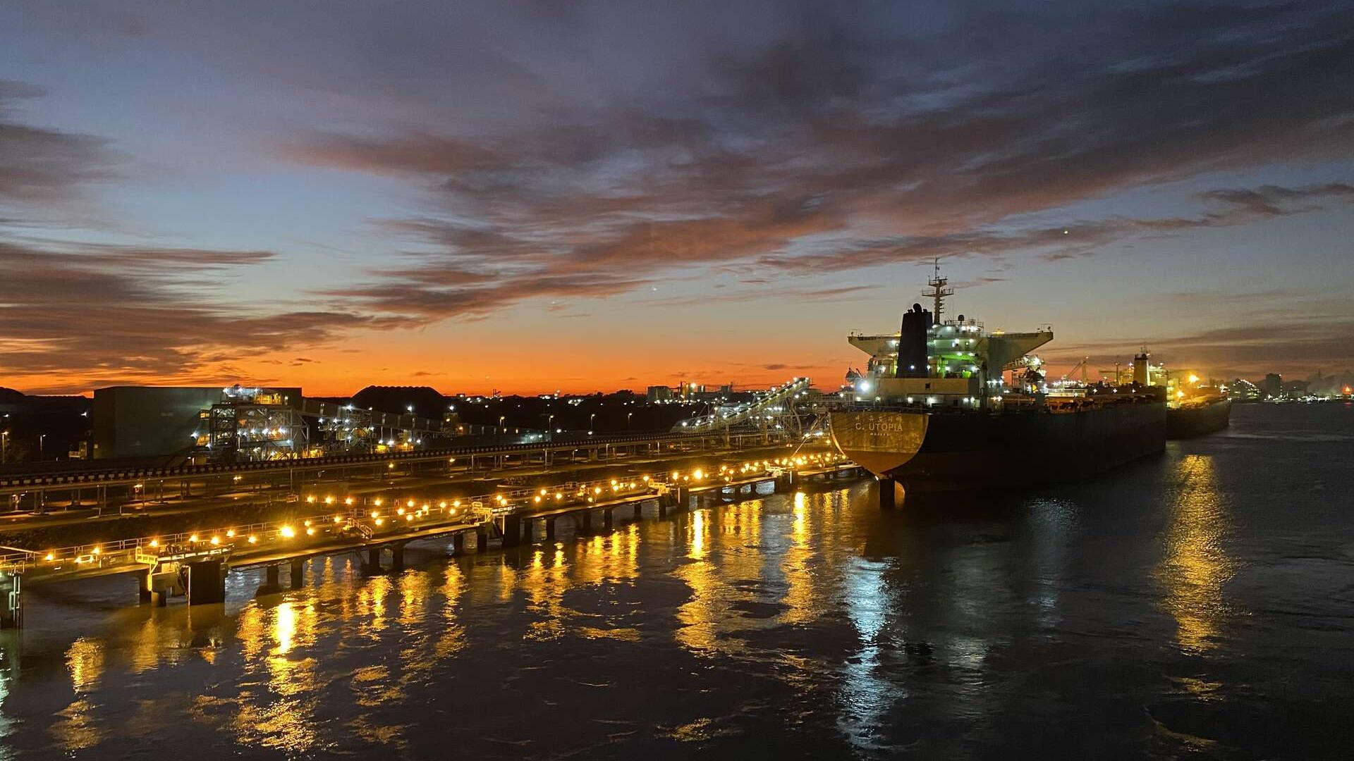 A cargo ship at berth in Newcastle at dawn