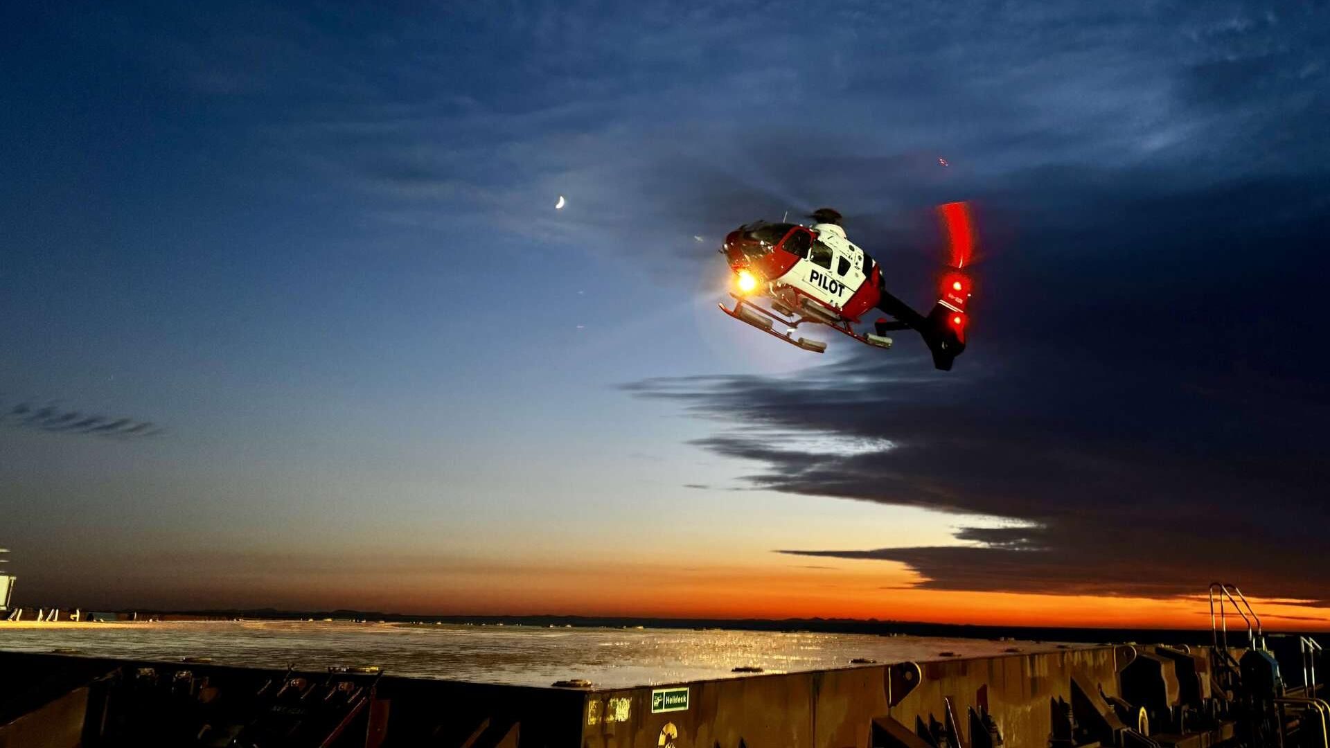 Pilot helicopter above a bulk carrier