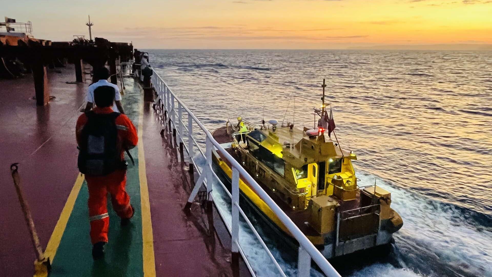 View from aboard a cargo ship with Port Authority pilot vessel alongside