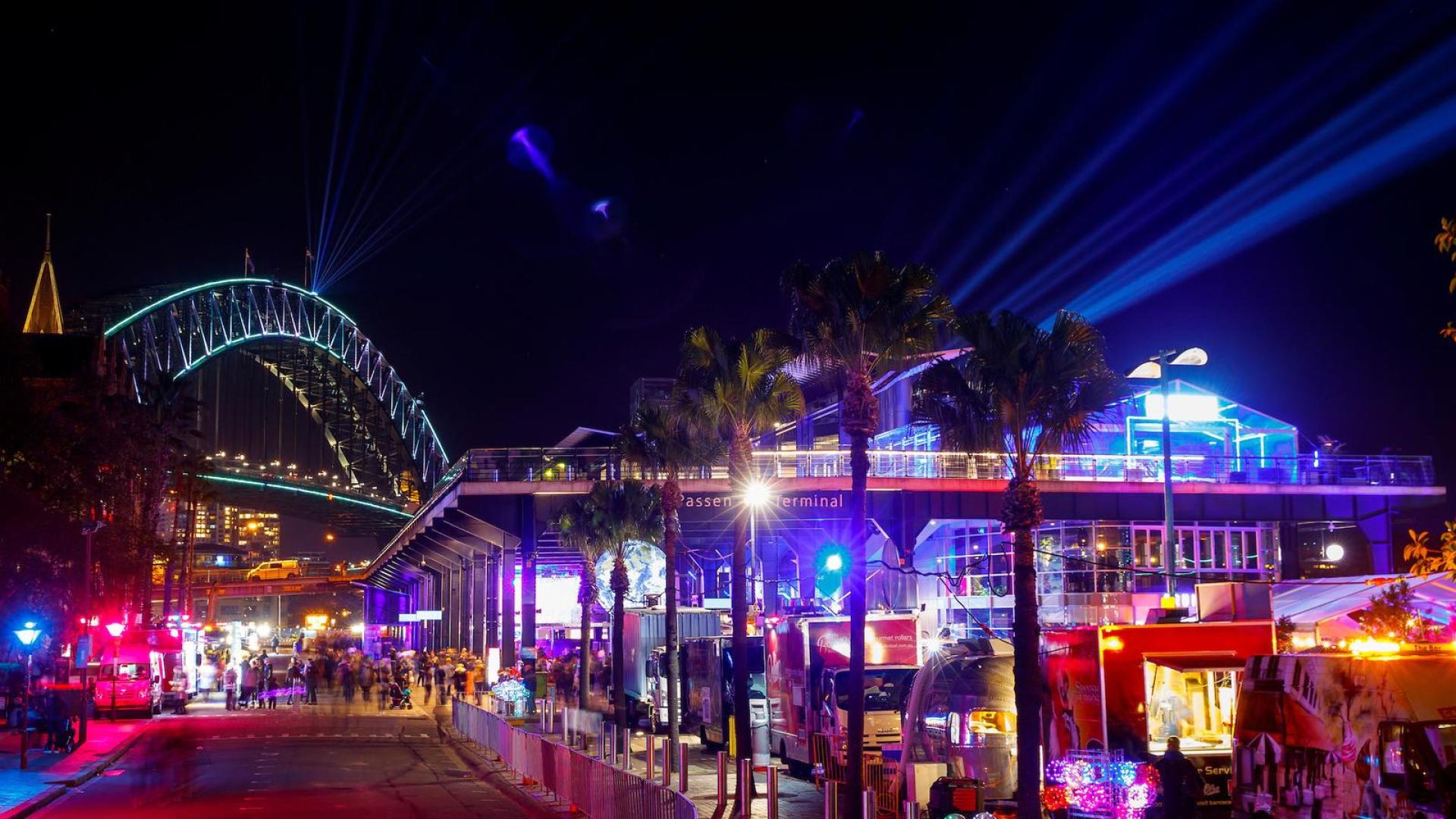 Food trucks at Overseas Passenger Terminal during Vivid Sydney with lights in the background