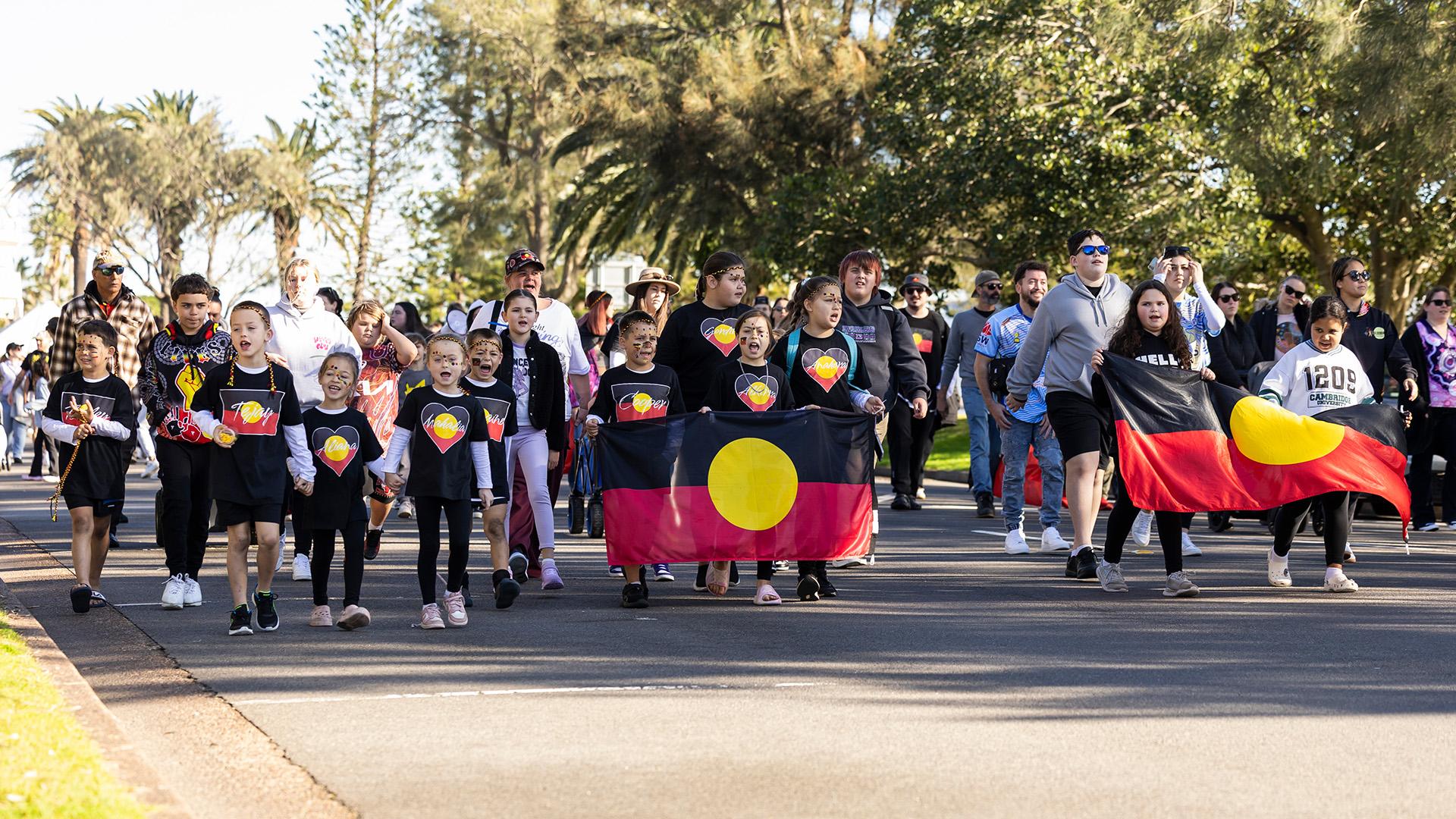 NAIDOC Week Newcastle march with flags