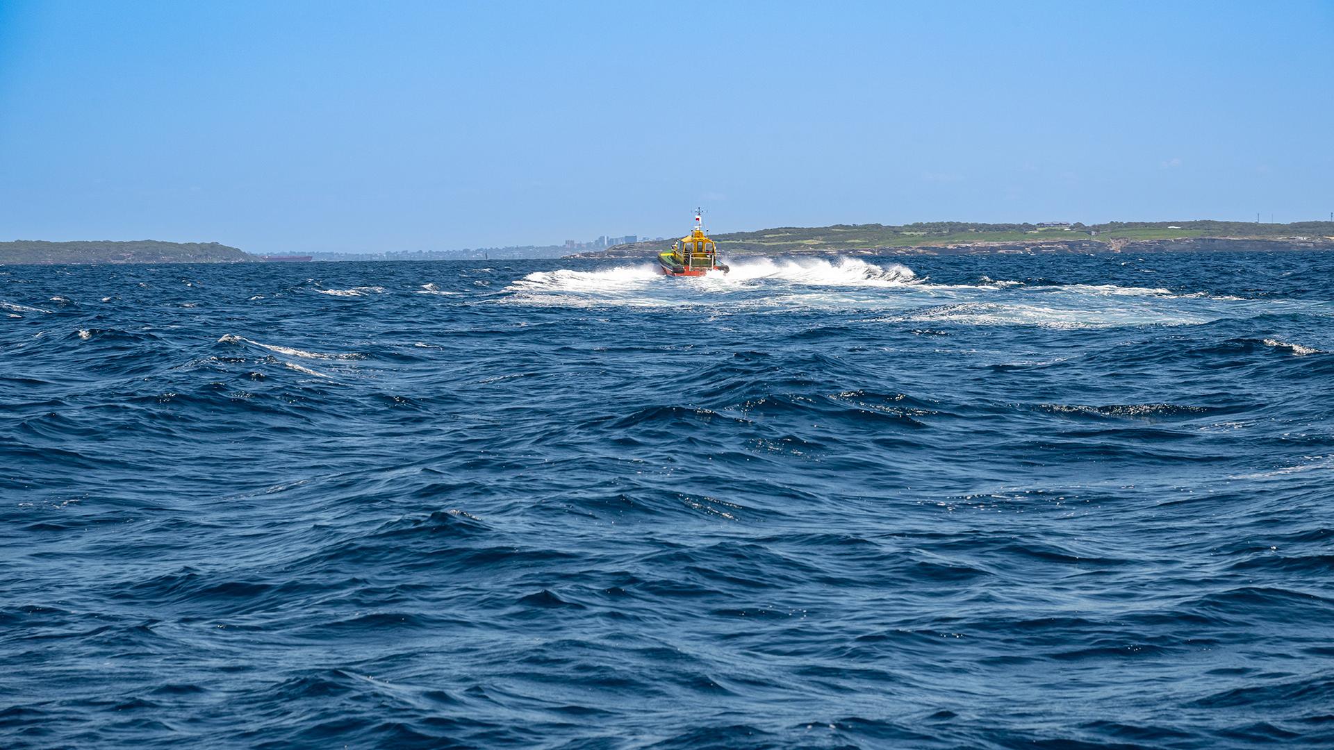 Water, waves and blue sky with pilot boat Port Botany 